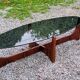 Designer coffee table by Hugues Poignant in rosewood and smoked glass from the 70s