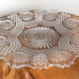 Vintage pressed glass plate with rosette design, octagonal rim, star pattern reminiscent of mandala
