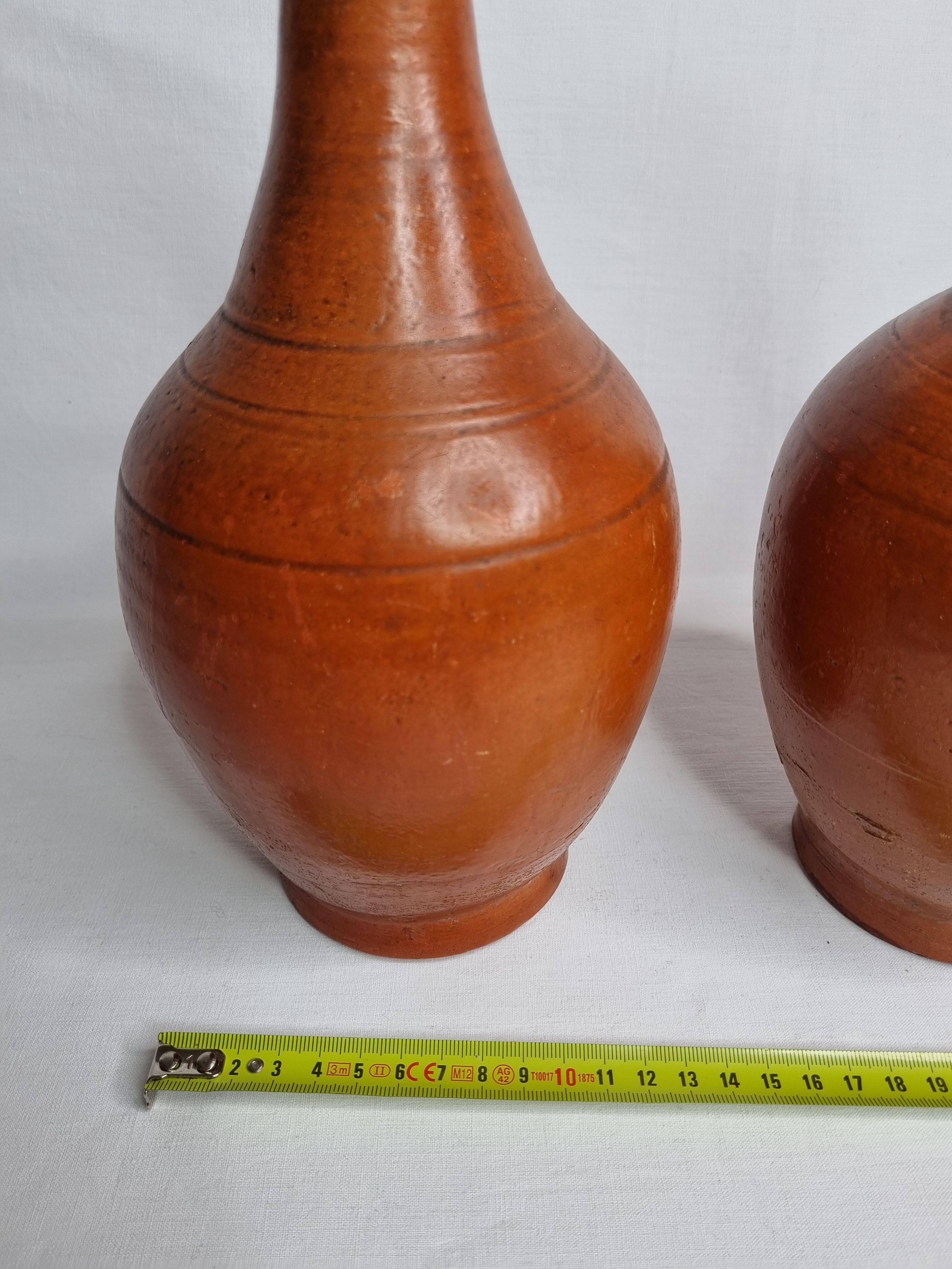 Pair of glazed terracotta jars, 26 cm