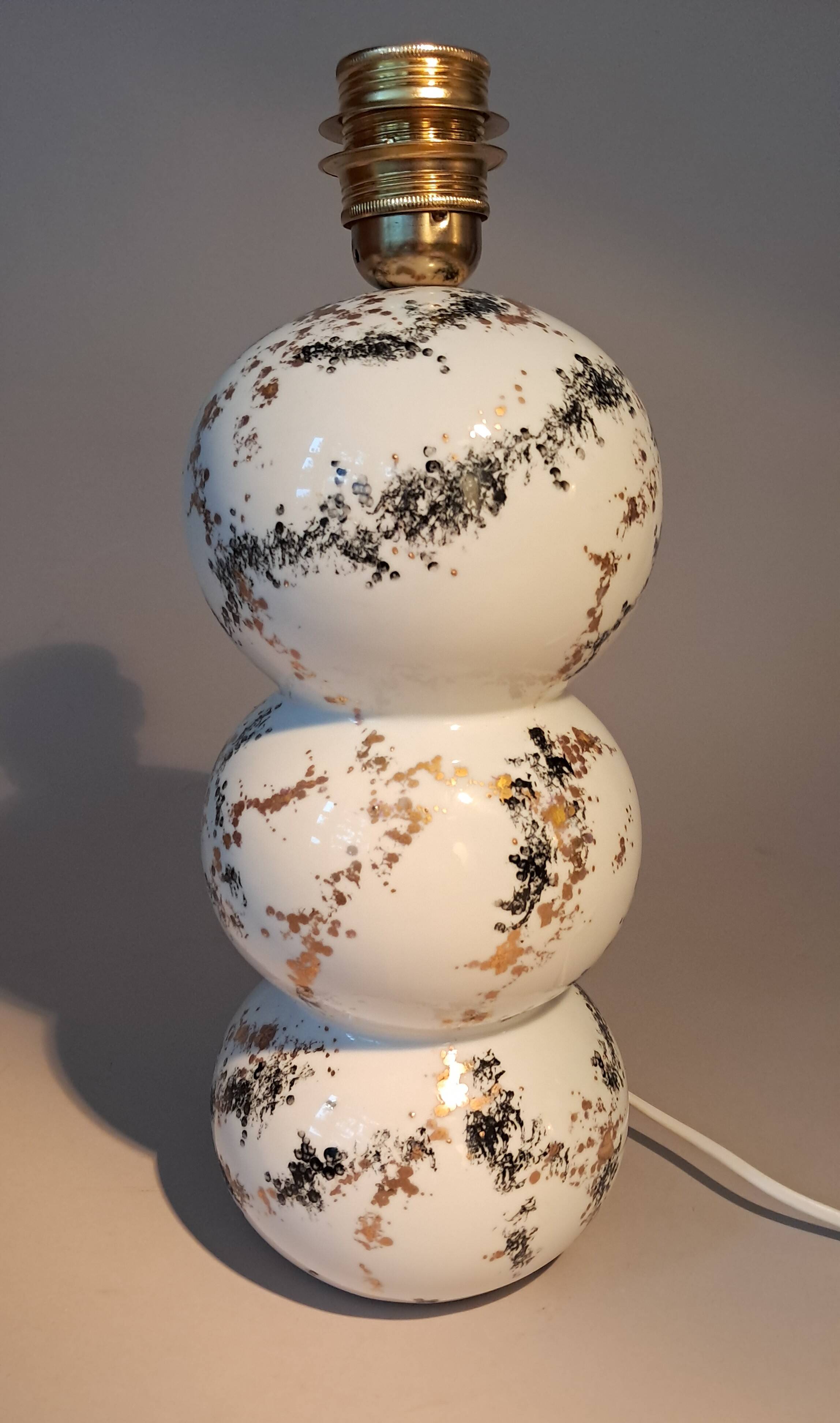 Fine porcelain lamp painted and gilded with fine gold. Laure Selignac, Paris.
