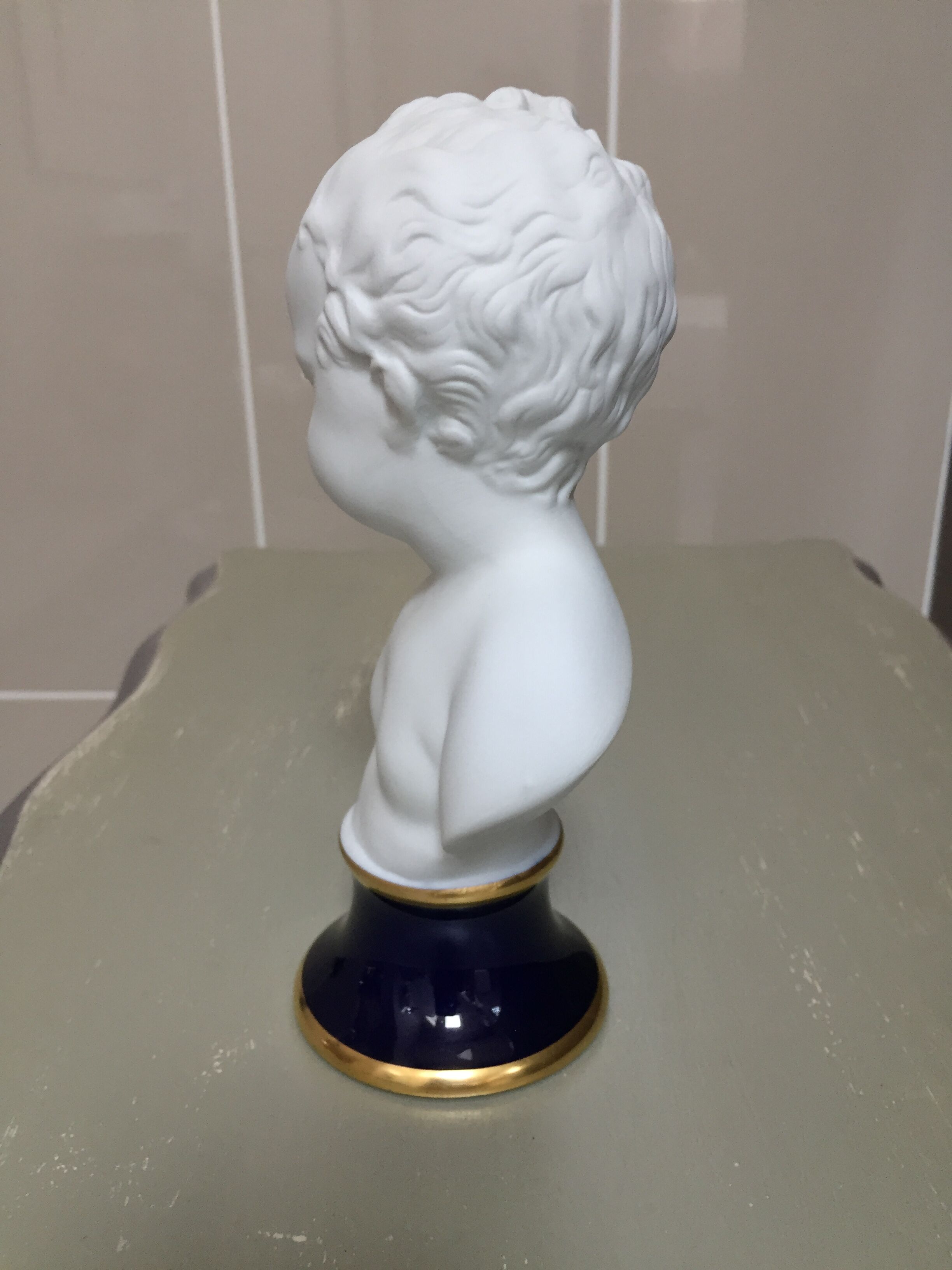 Child bust in limoges porcelain