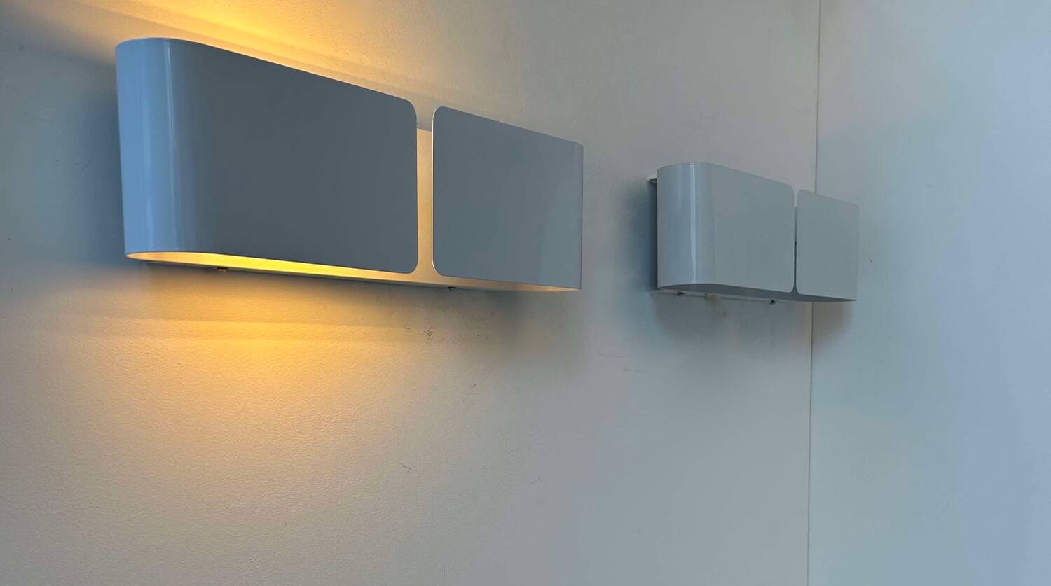 Pair of vintage wall lights, curved white metal, France 1980