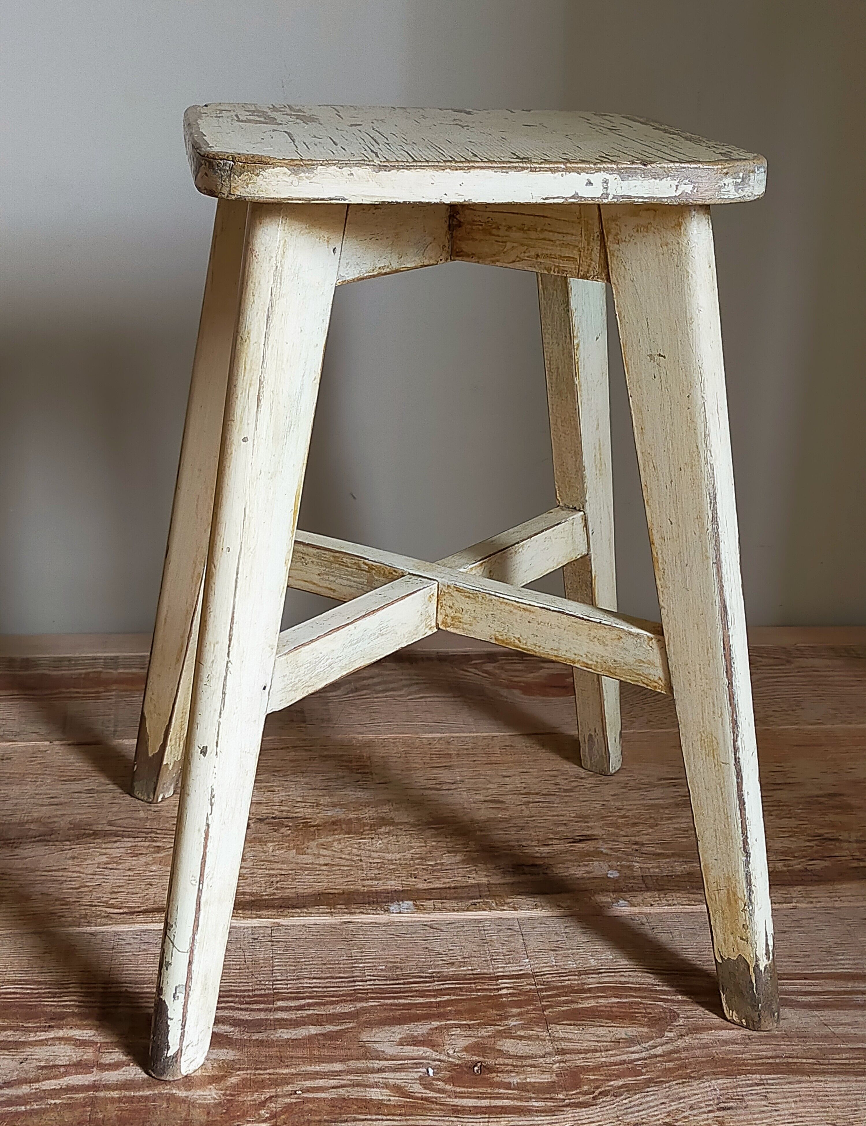 Old workshop stool in patinated solid wood