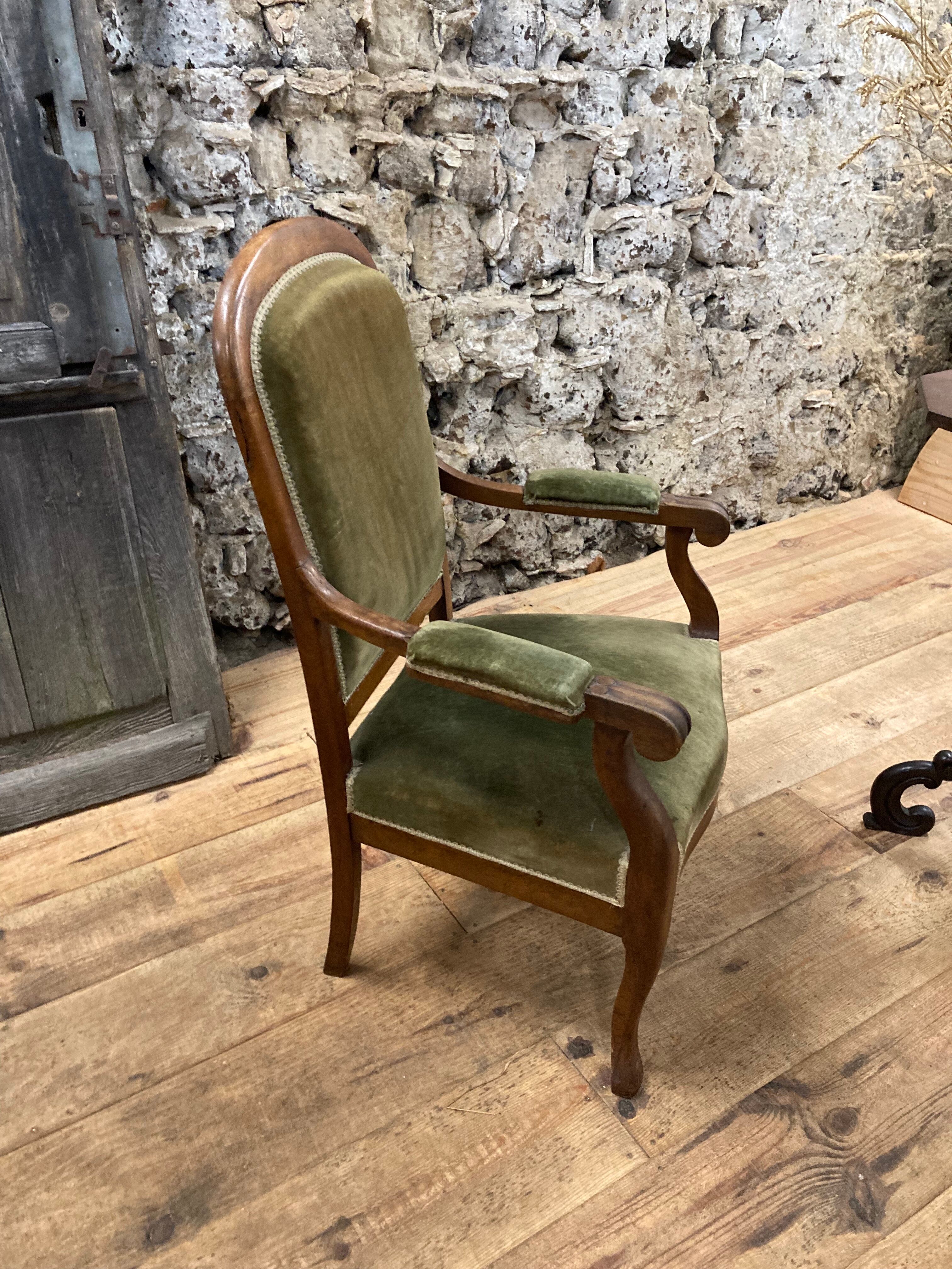 Antique Voltaire armchair in wood and green velvet Louis Philippe