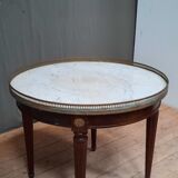 Tablr low dessu marble called "hot water bottle"