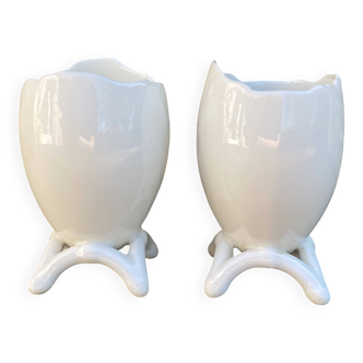 Antique porcelain egg cups in shell shape.
