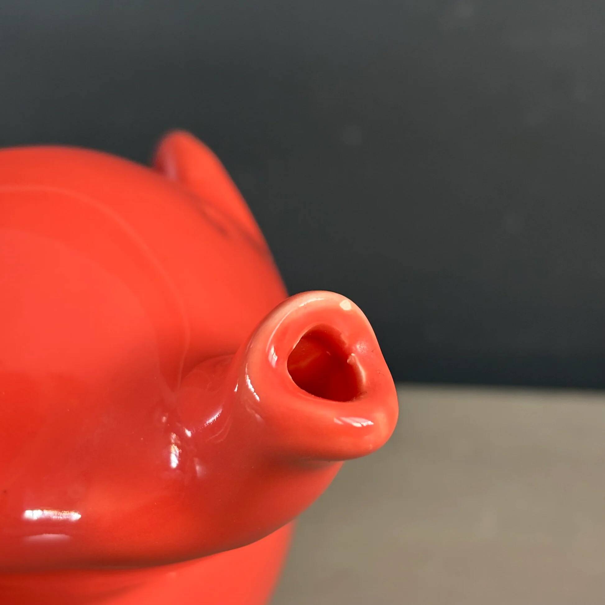 Large coral-coloured elephant teapot.