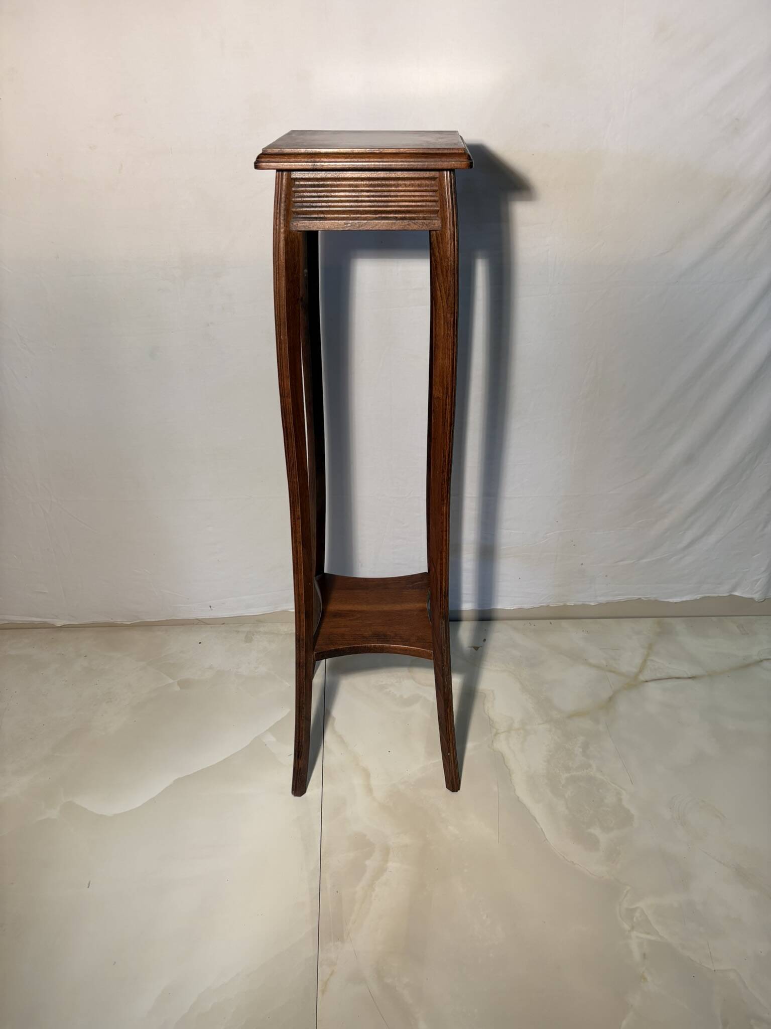 Vintage dark wood side table with curved base