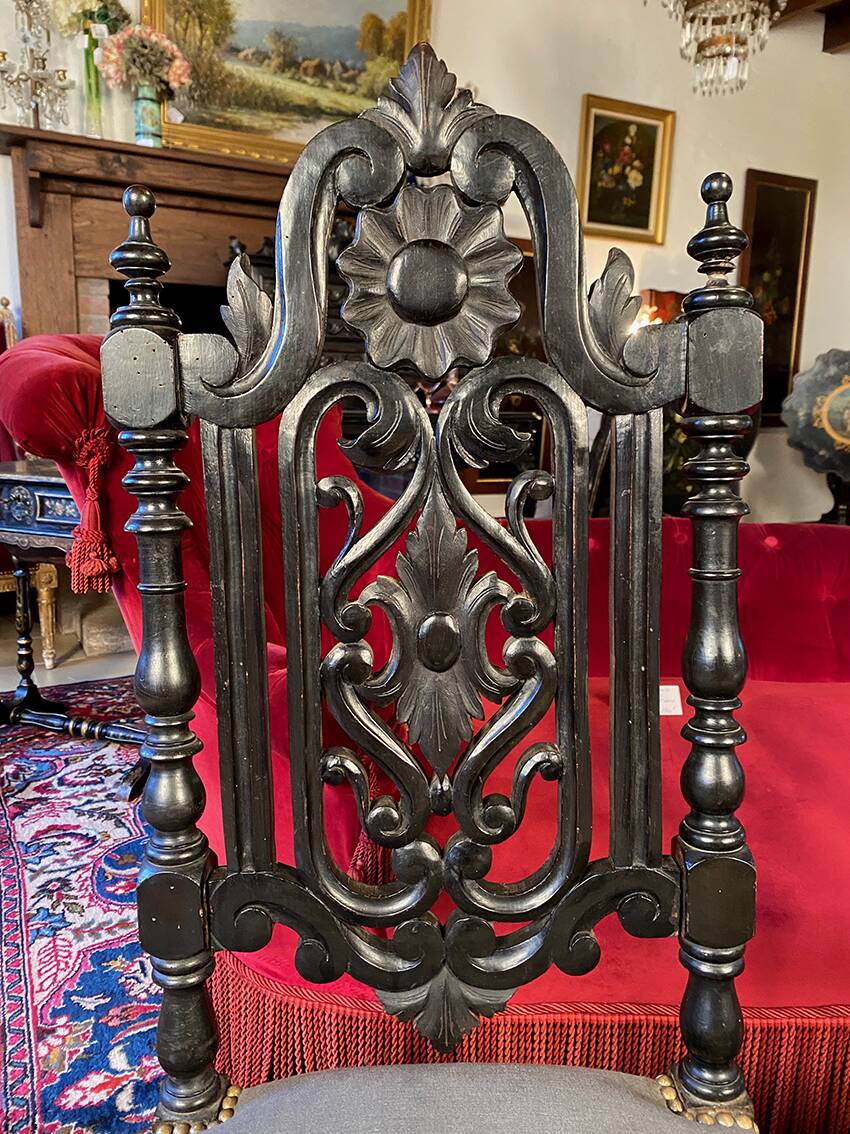 Fake pair of low Napoleon III chairs in blackened wood.