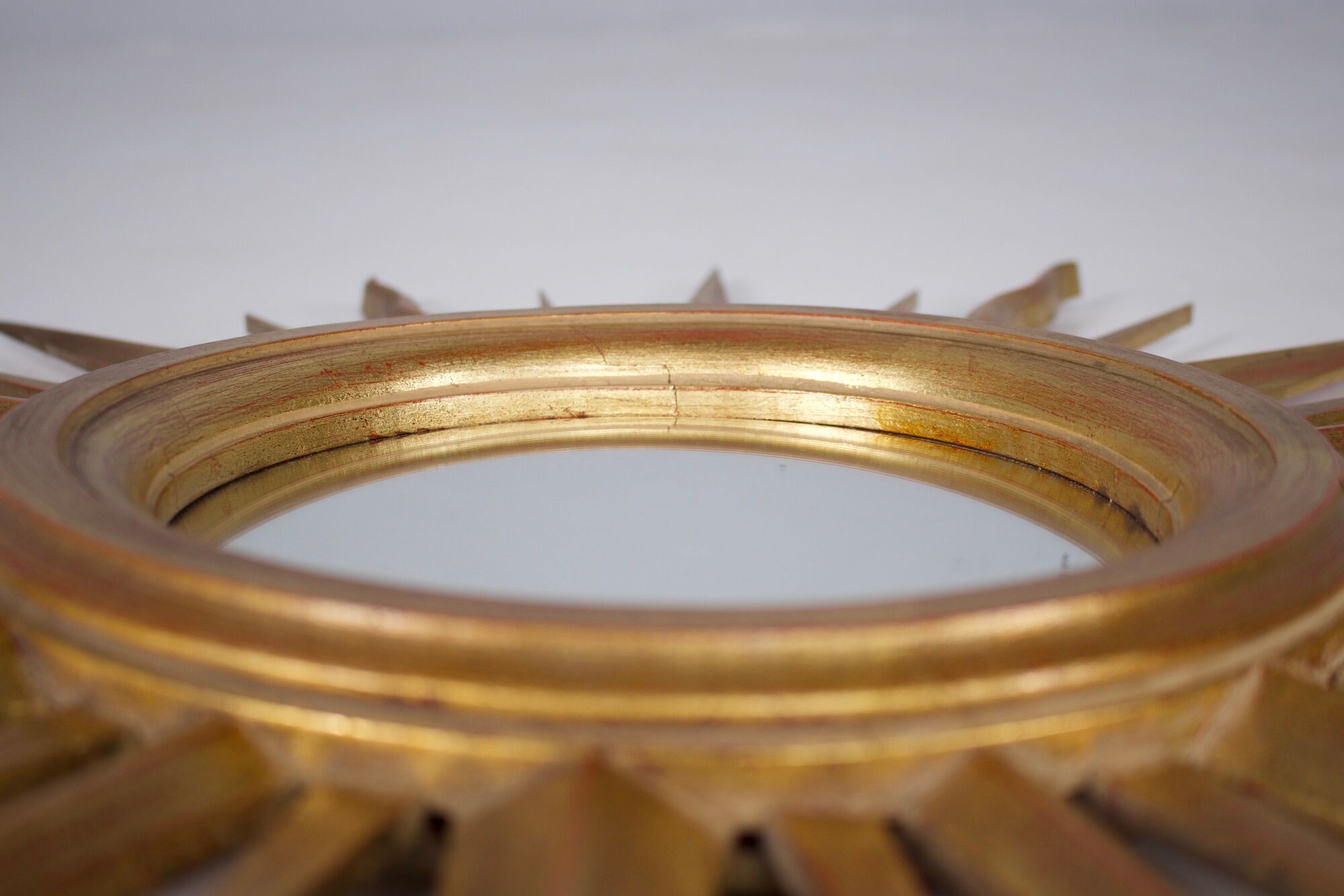 Sun mirror in gilded wood