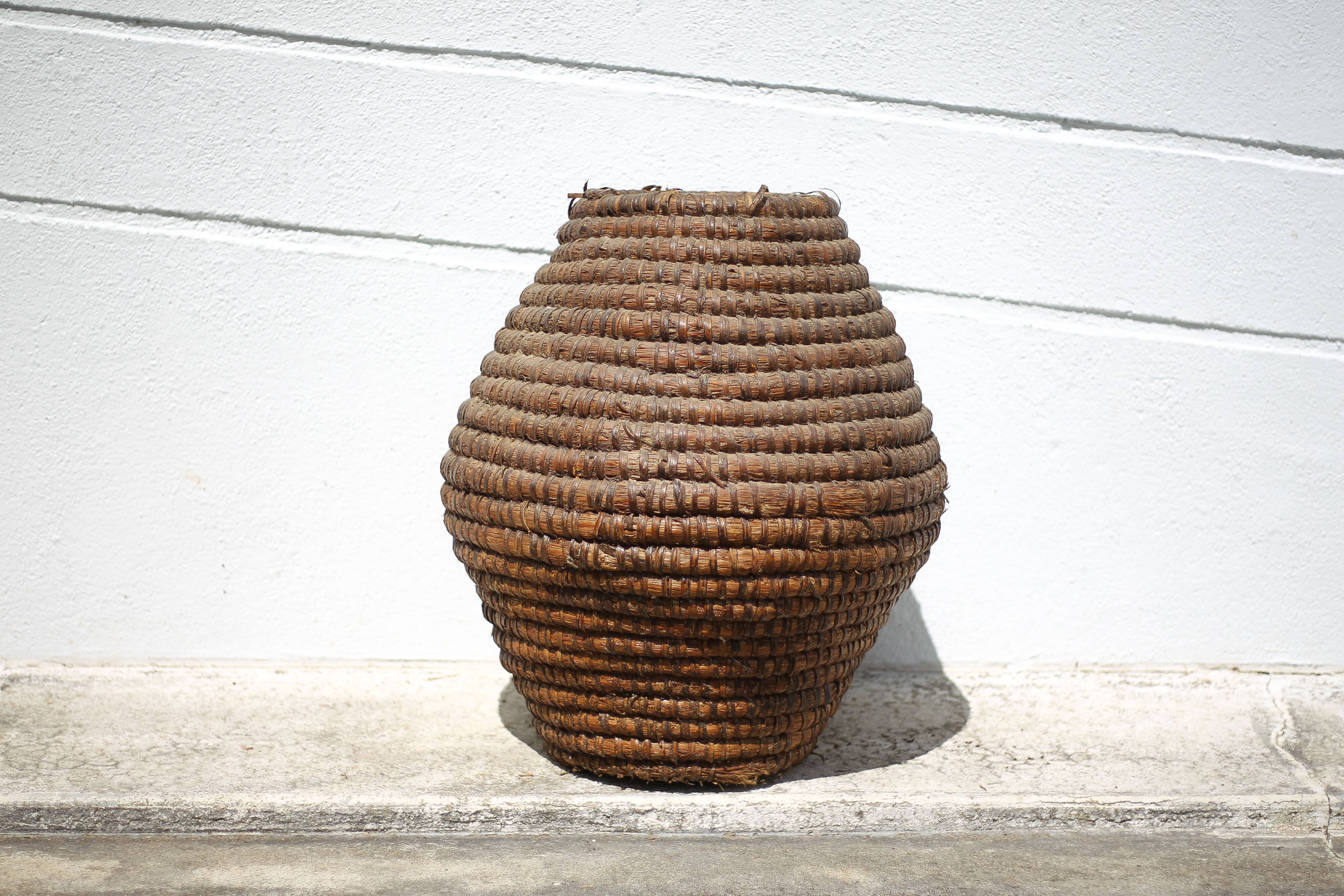 Old basket, burgundy straw and bramble, woven basket, interior decoration
