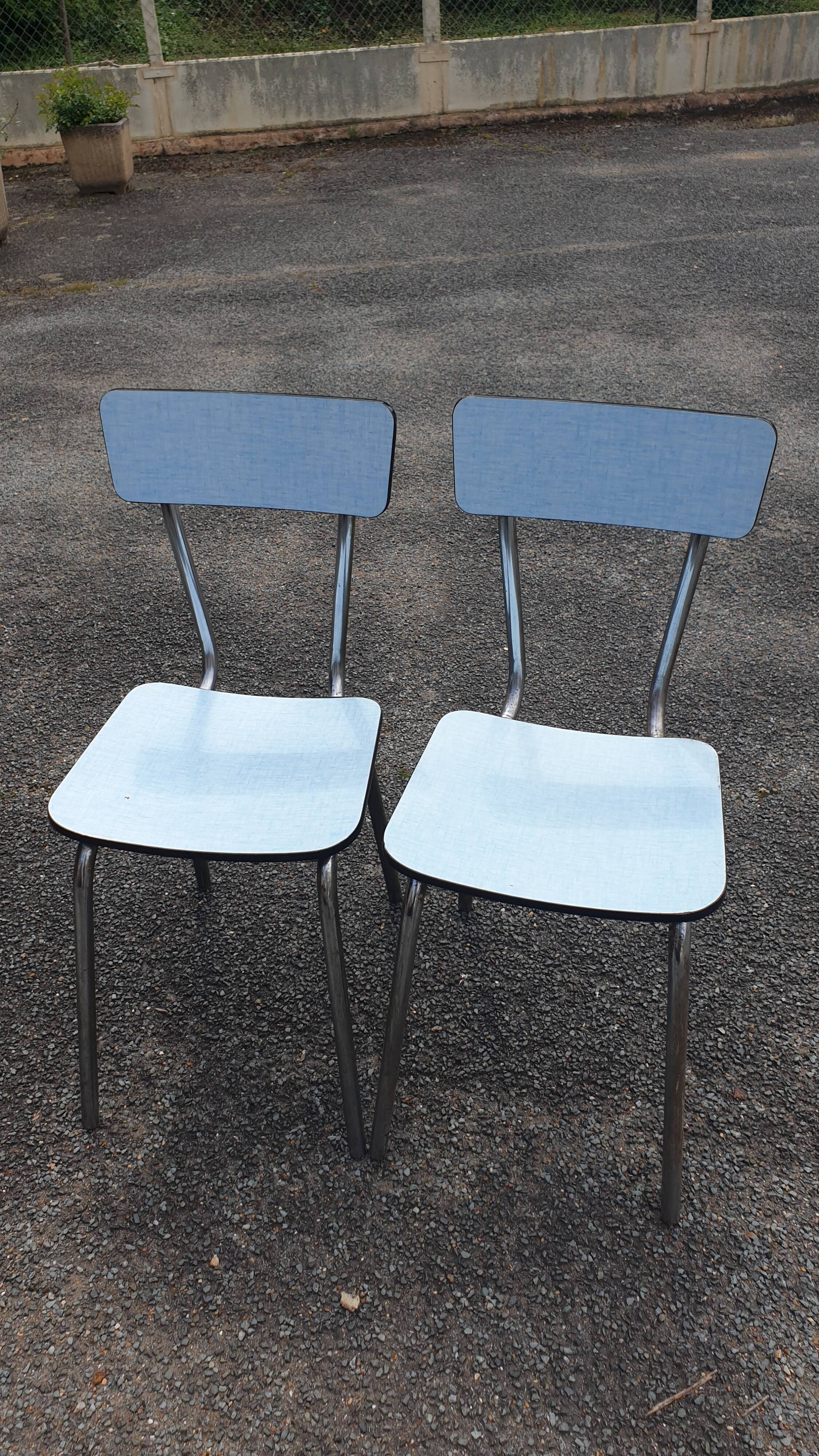 2 sky blue Formica chairs