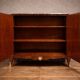 Wooden cabinet with doors, richly inlaid with floral patterns, Louis XV style.