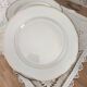 Set of 6 flat plates in fine white Bohemian porcelain with a gold rim.