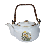 Vintage teapot with wicker handle