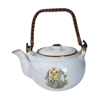 Vintage teapot with wicker handle