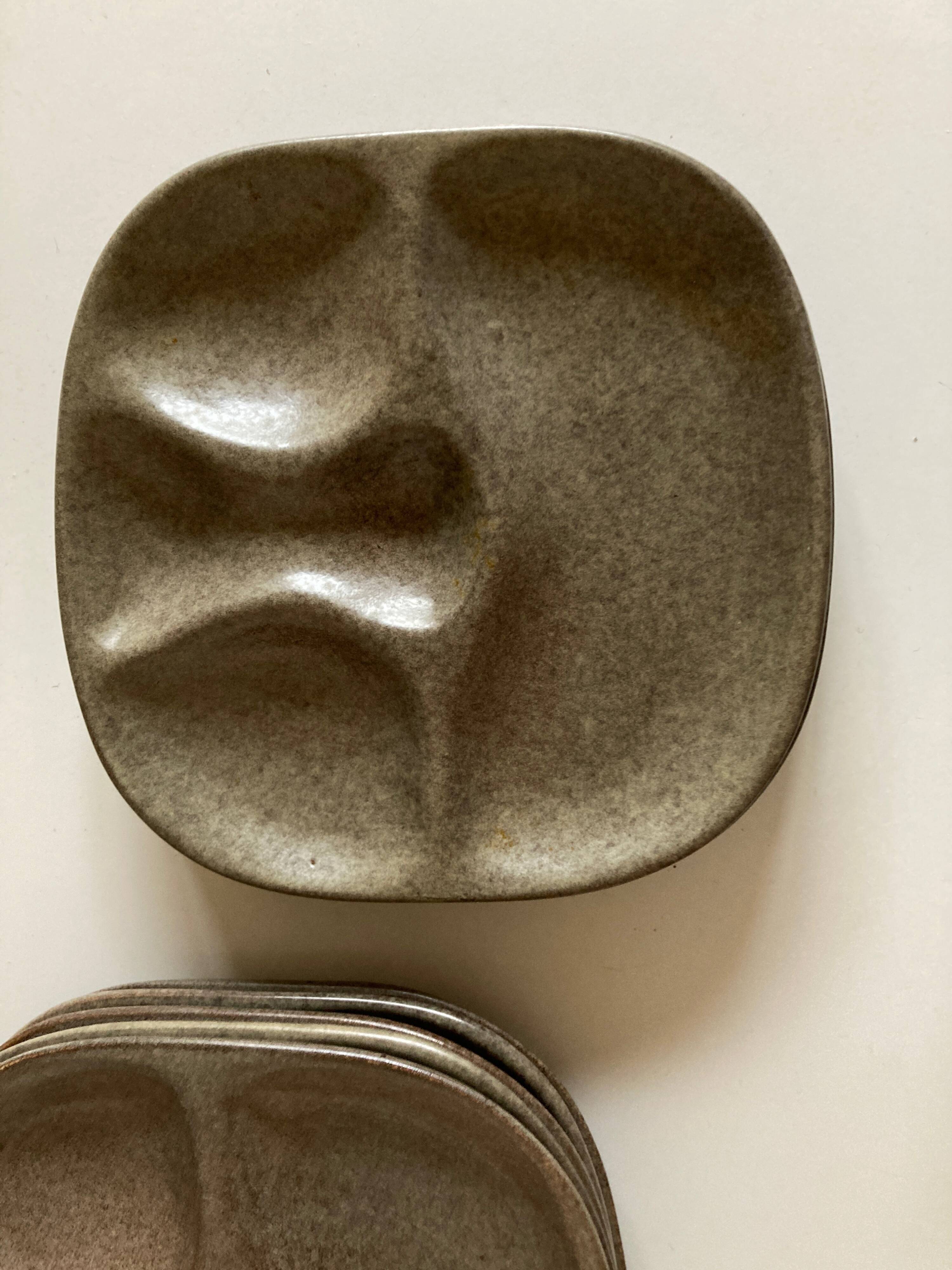 Set of 8 mid century modern stoneware potter's plates to identify