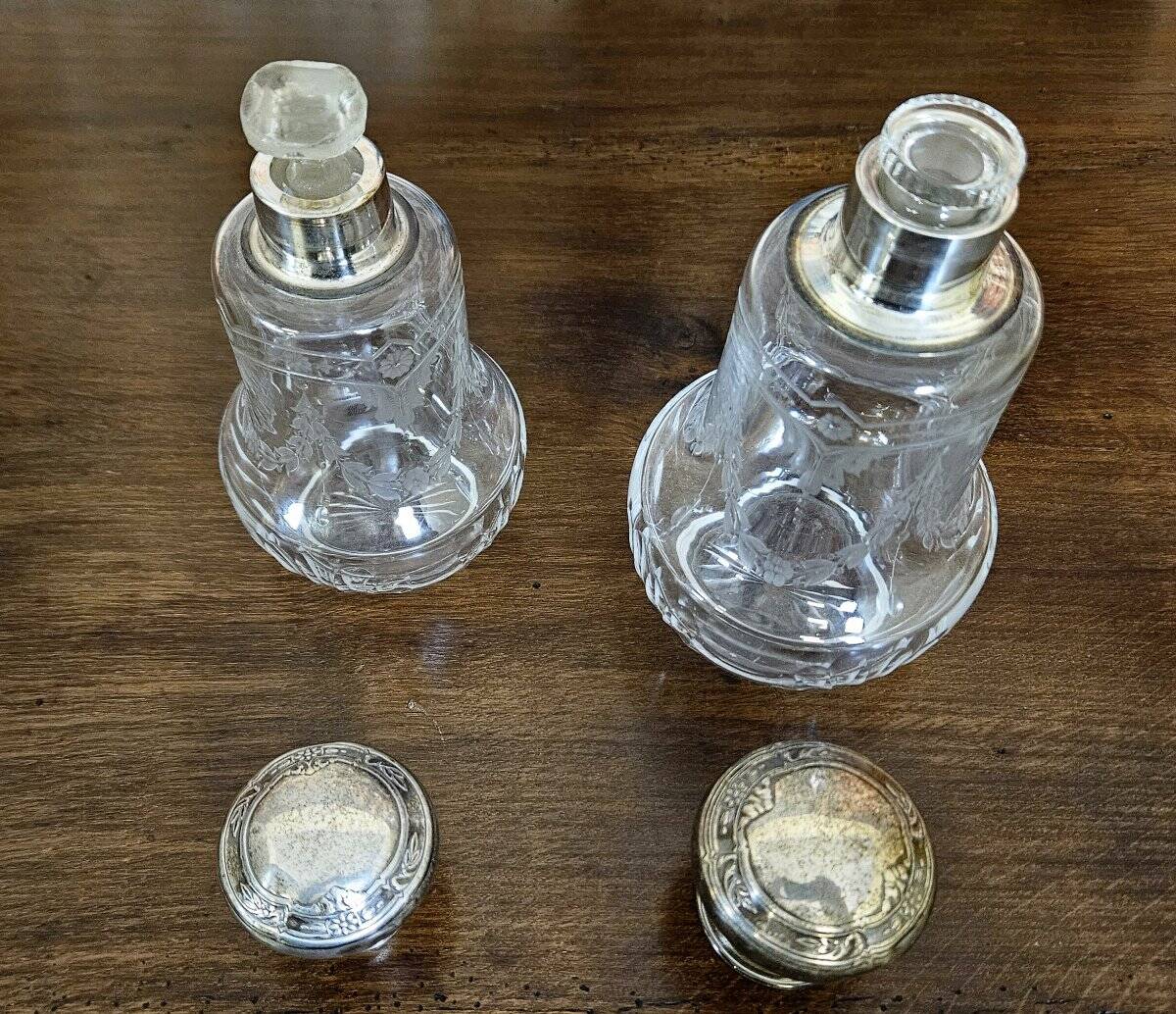 Pair of antique Louis XVI style bottles in finely engraved crystal and silver.