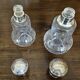 Pair of antique Louis XVI style bottles in finely engraved crystal and silver.