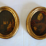 Set of 2 paintings in oval frames
