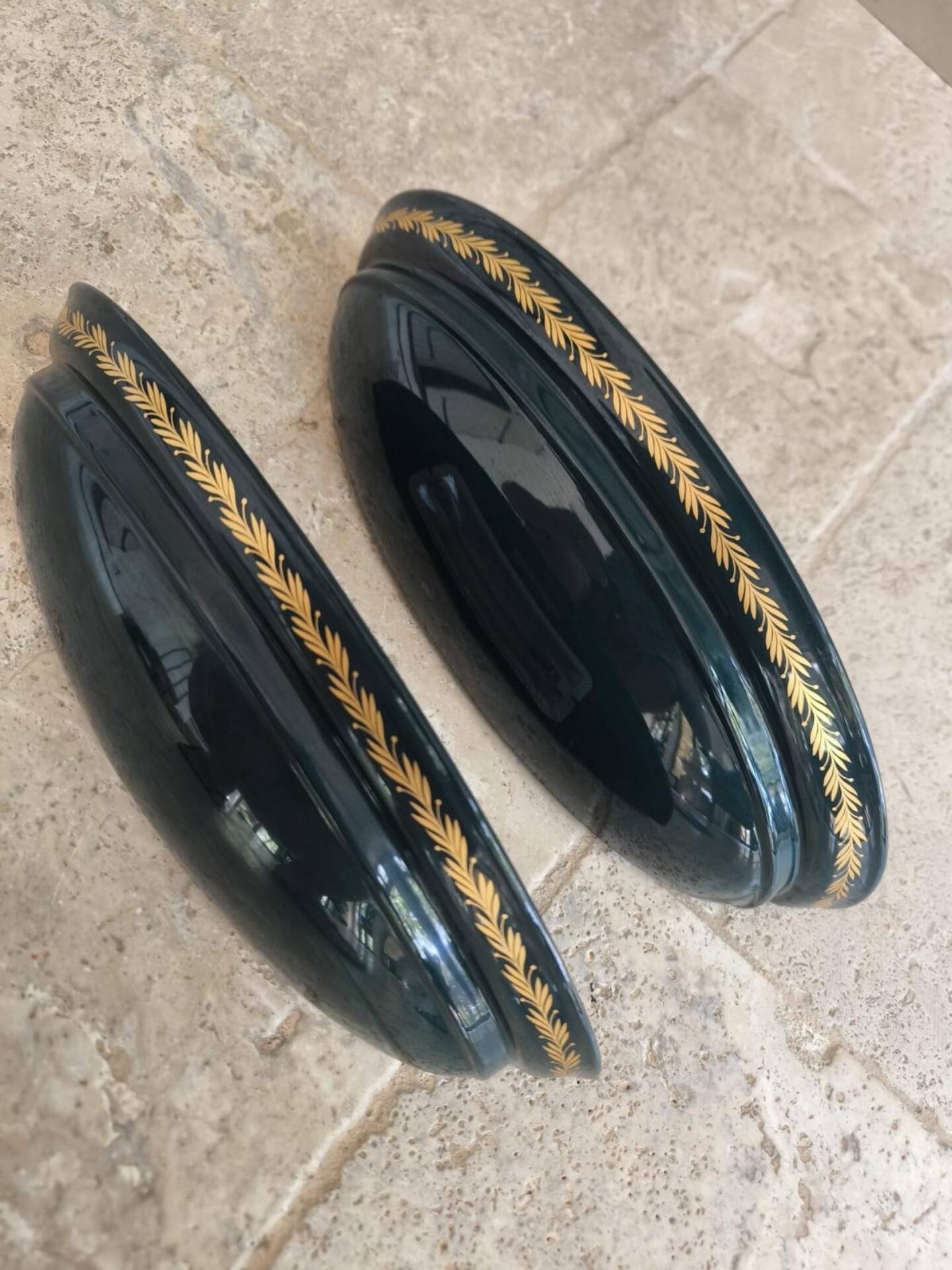 Set of two vintage wall sconces in pine green and gold.