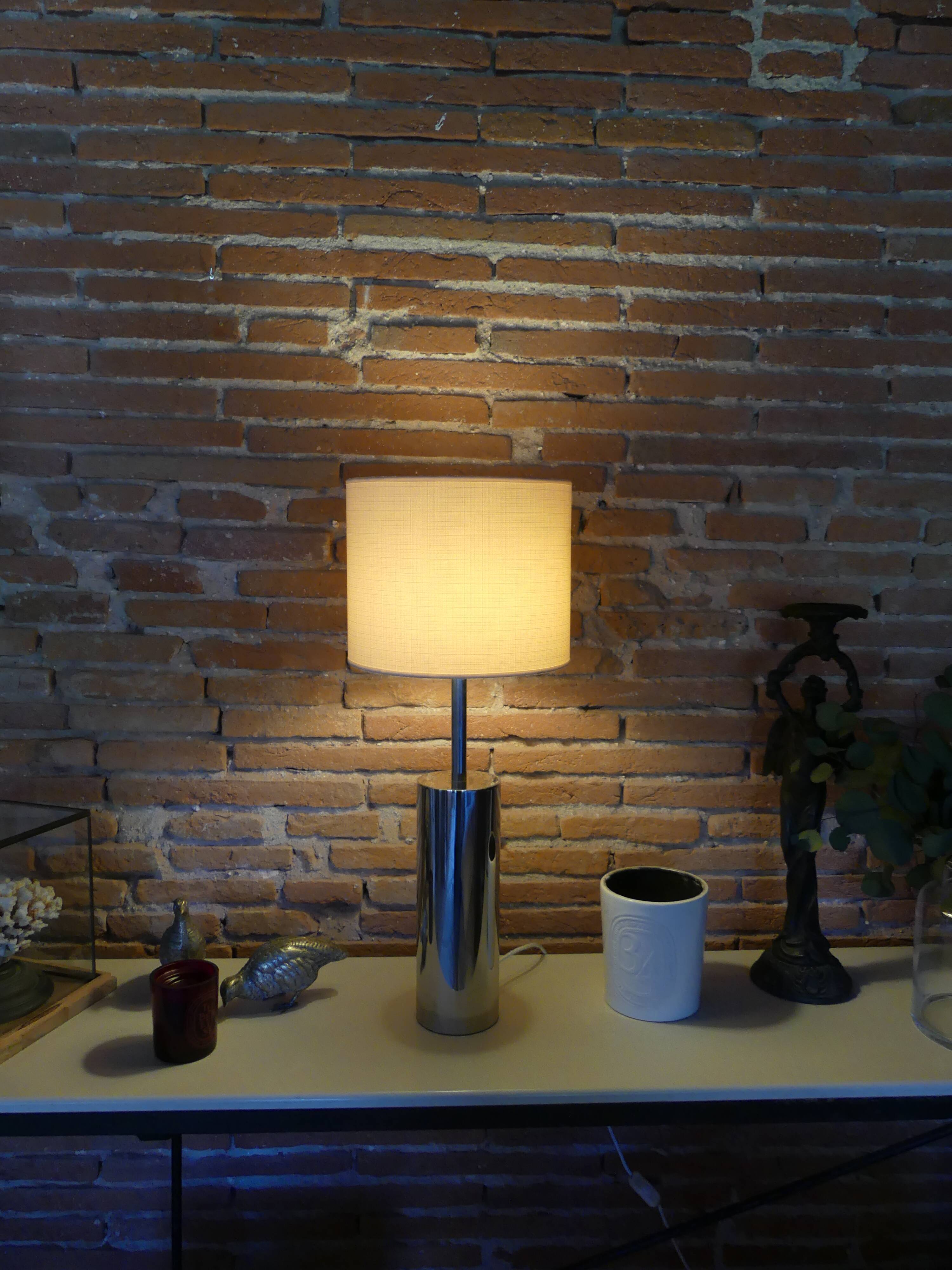 Foot of chrome lamps and ivory white lampshade