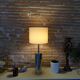 Foot of chrome lamps and ivory white lampshade