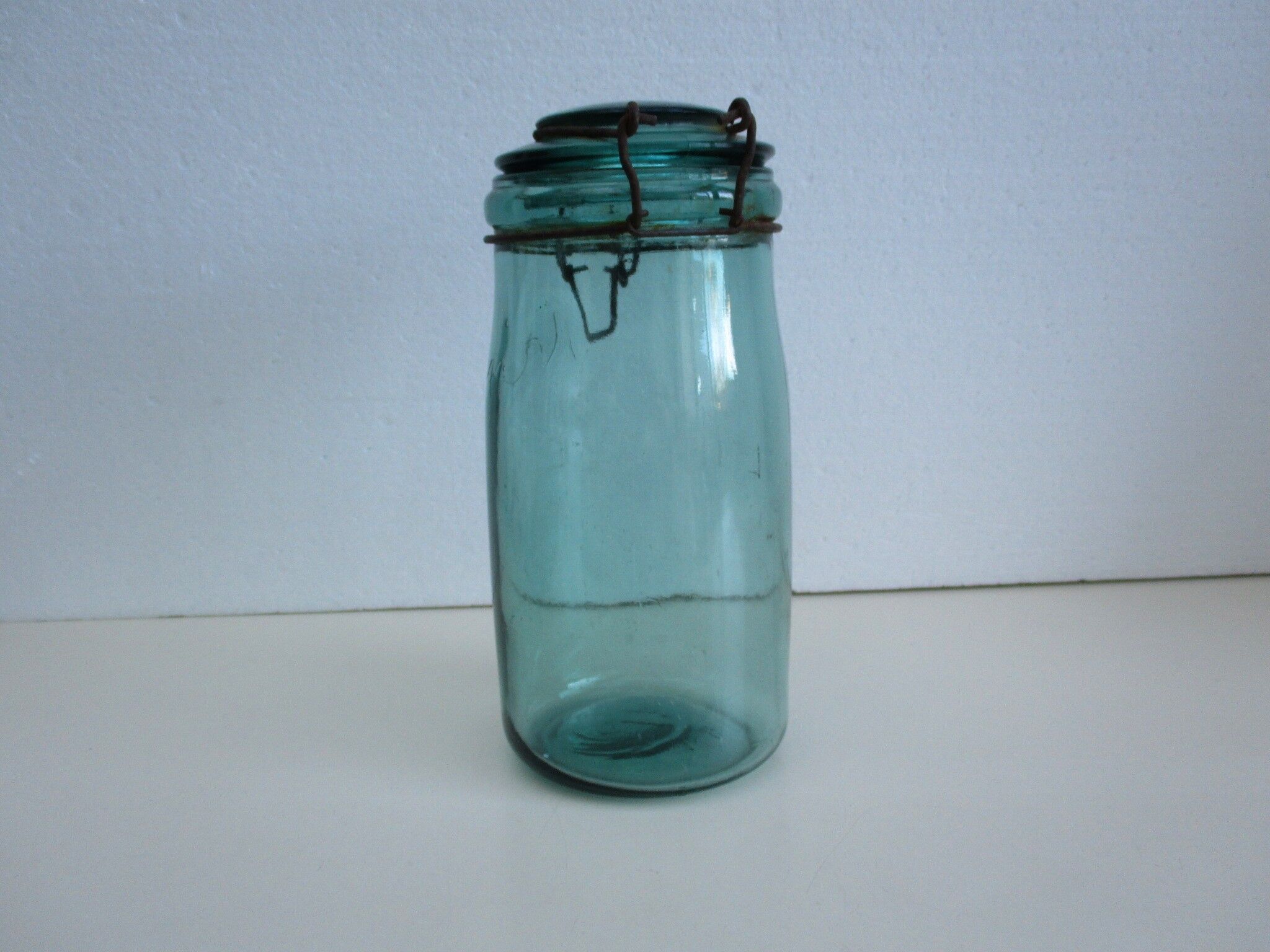 Old green glass jar "L'IDEALE"