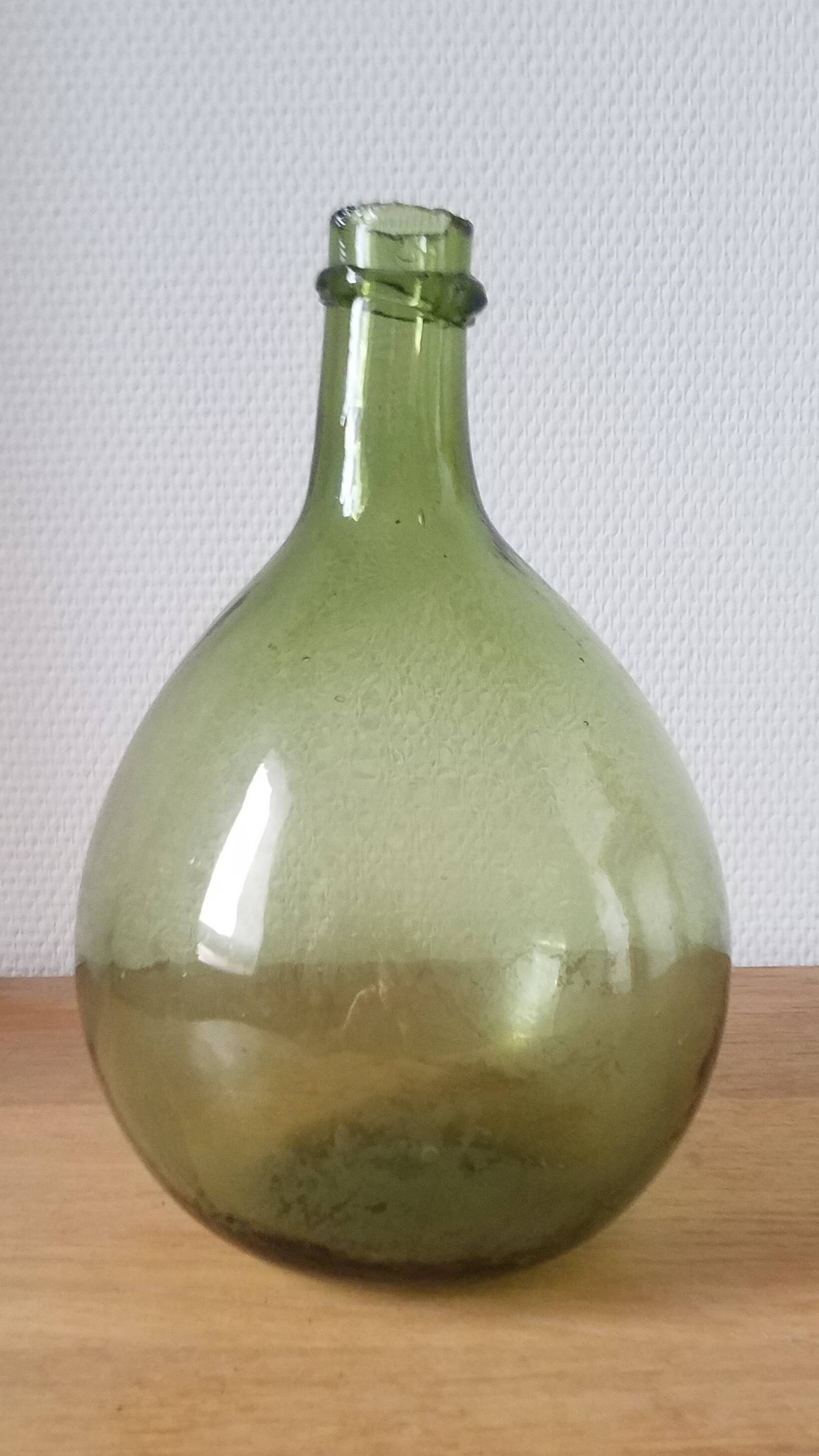 Vintage green demijohn