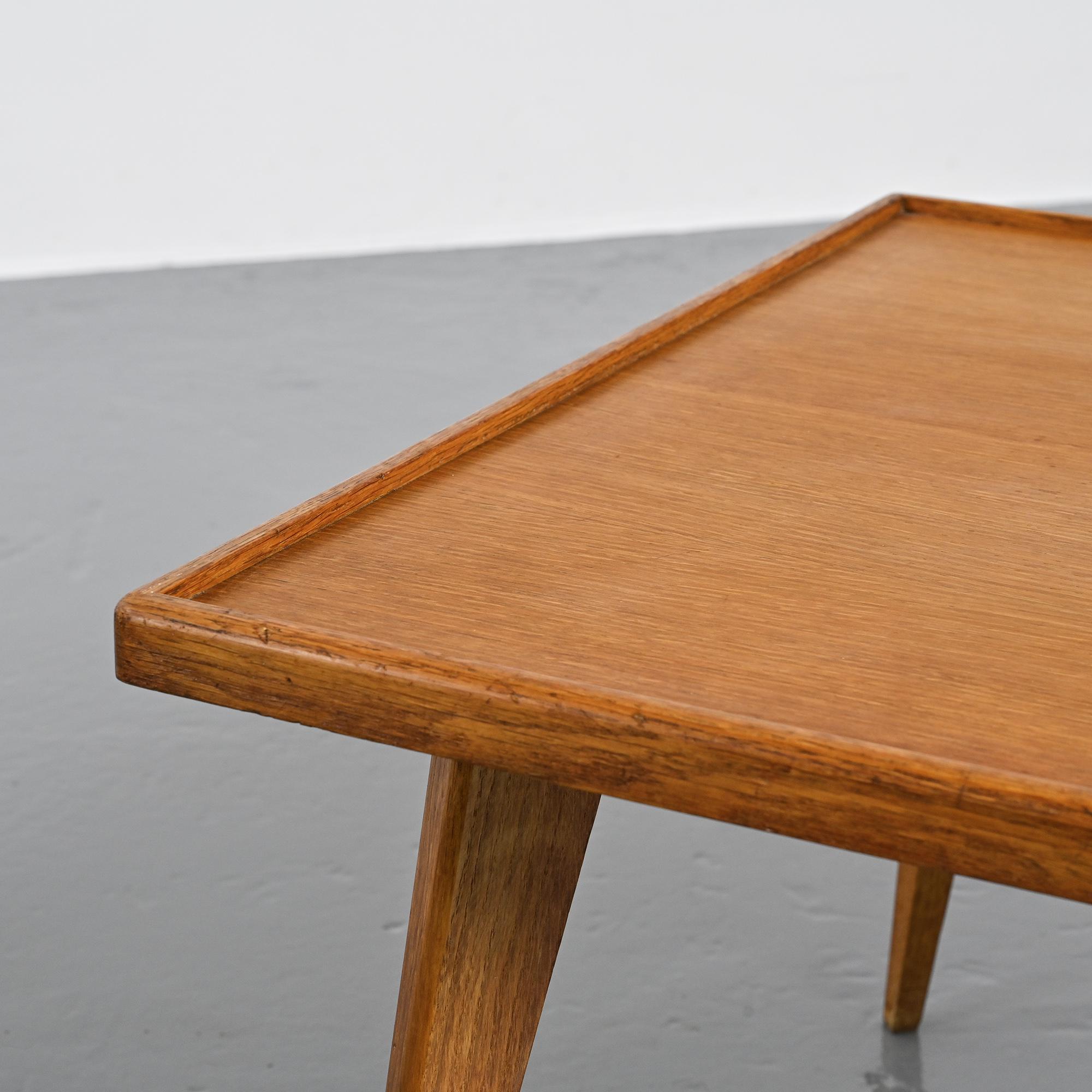 Coffee table with tapered legs, France, circa 1950-1960.