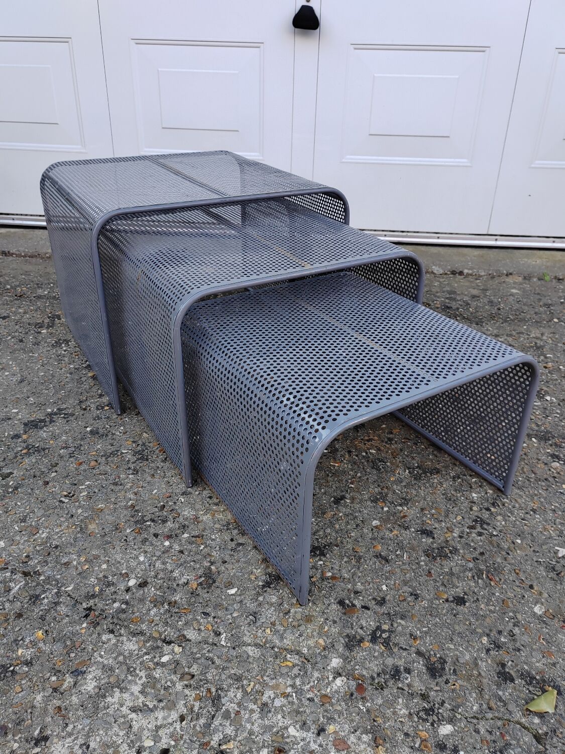 Nested tables with perforated metal from the 1980s.