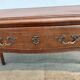 Louis XV style desk in wood, with a brown leather top.