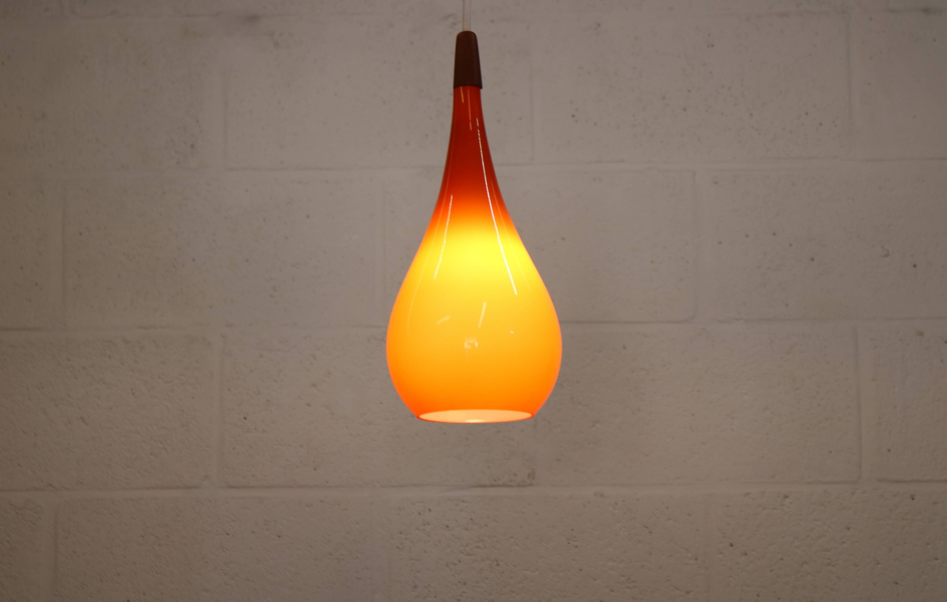 Orange teardrop glass pendant lamp made by Holmegaard - Denmark 1960