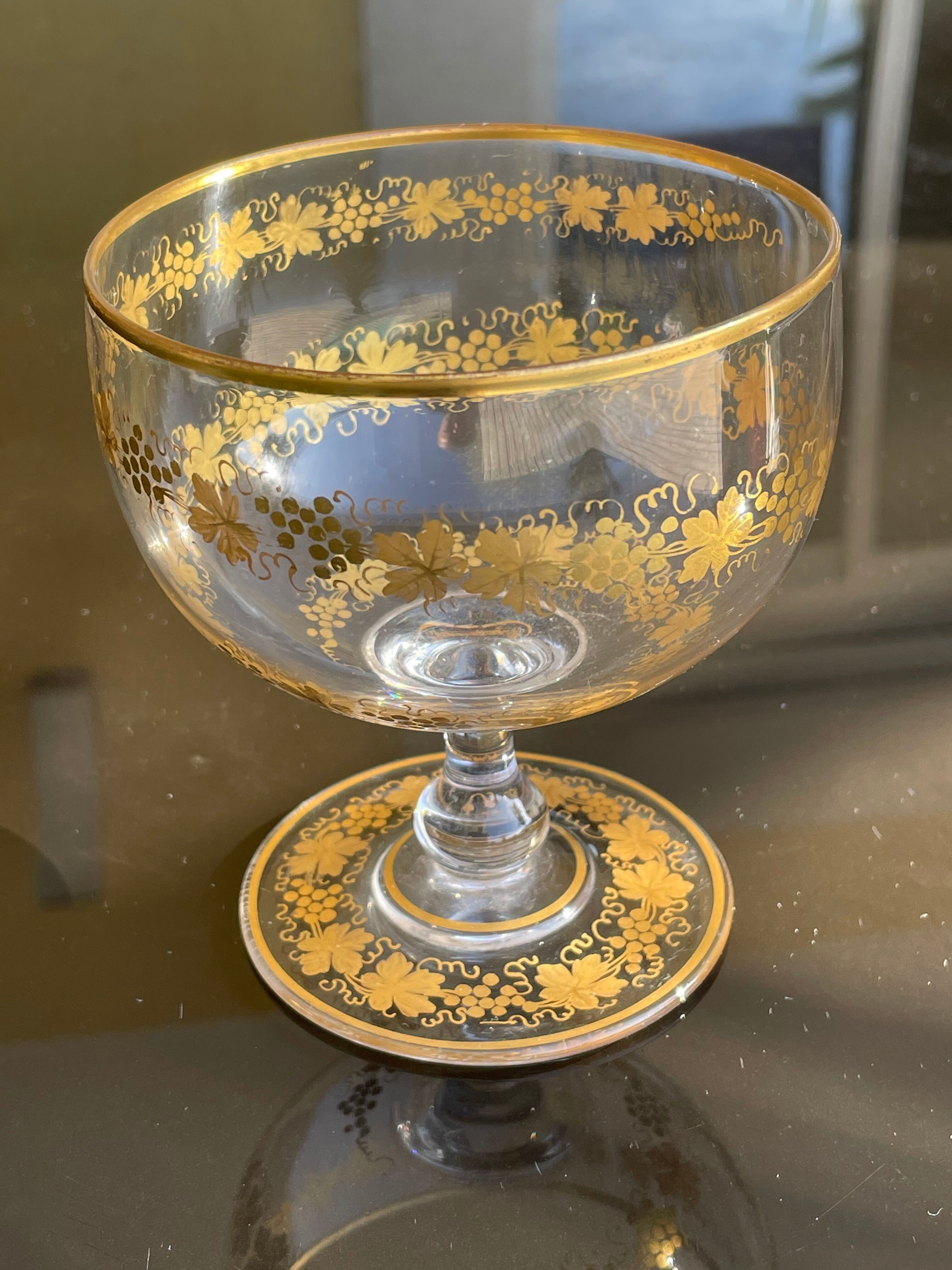 Glass cup decorated with golden vine decoration
