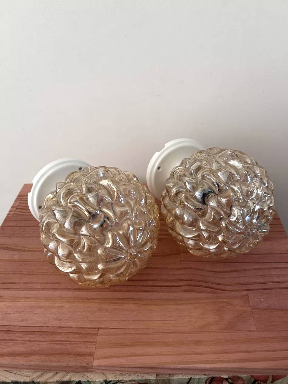 Pair of gold glass globe wall lights