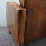 Paire de fauteuils en cuir de mouton