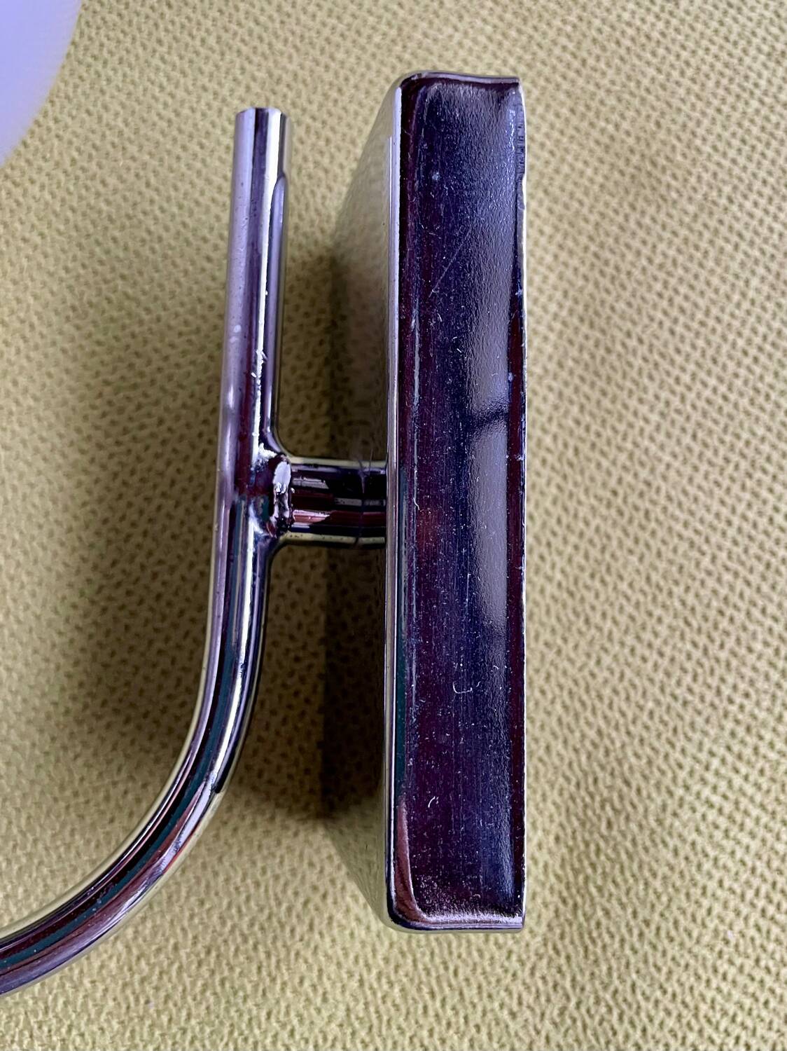 Pair of chrome metal wall lights with white glass globe.