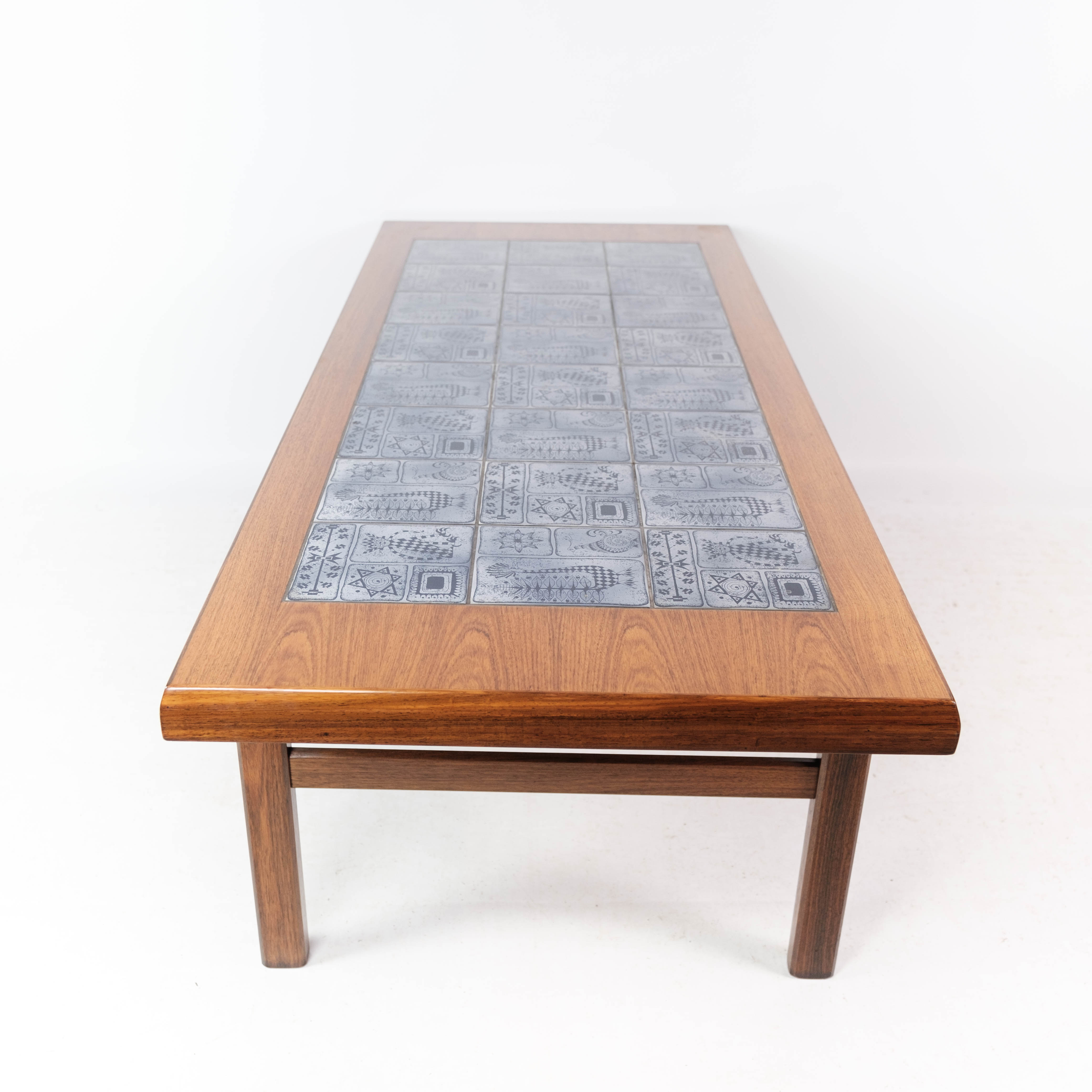 Coffee table in rosewood with blue tiles of Danish design by Arrebo Furniture, 1960s