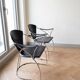 Pair of Linda Arrben armchairs from the 1970s in metal and black leather.