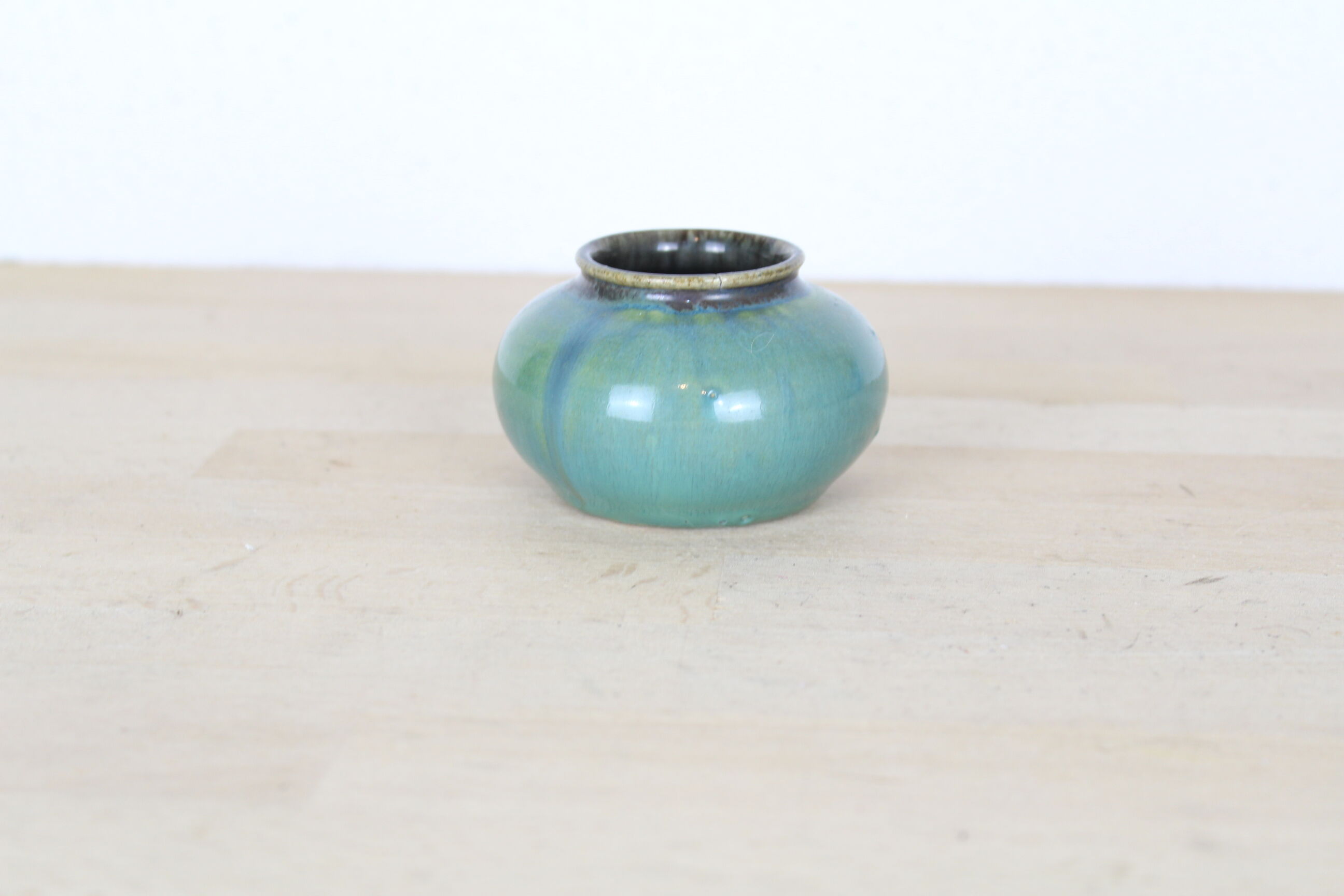 Ball vase with blue drippings