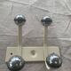 Industrial wall coat rack two hooks in white lacquered metal and vintage silver 1970