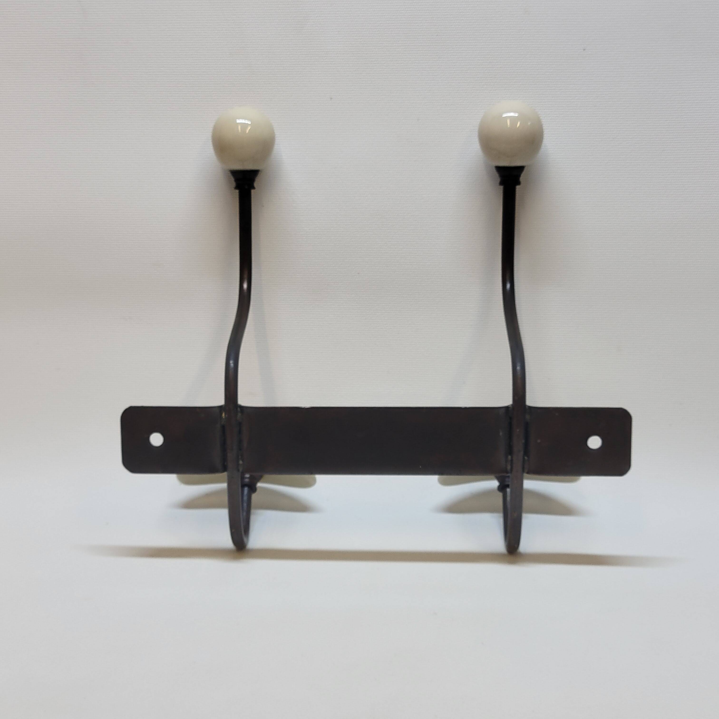 Wall coat rack in metal and porcelain with 2 hooks