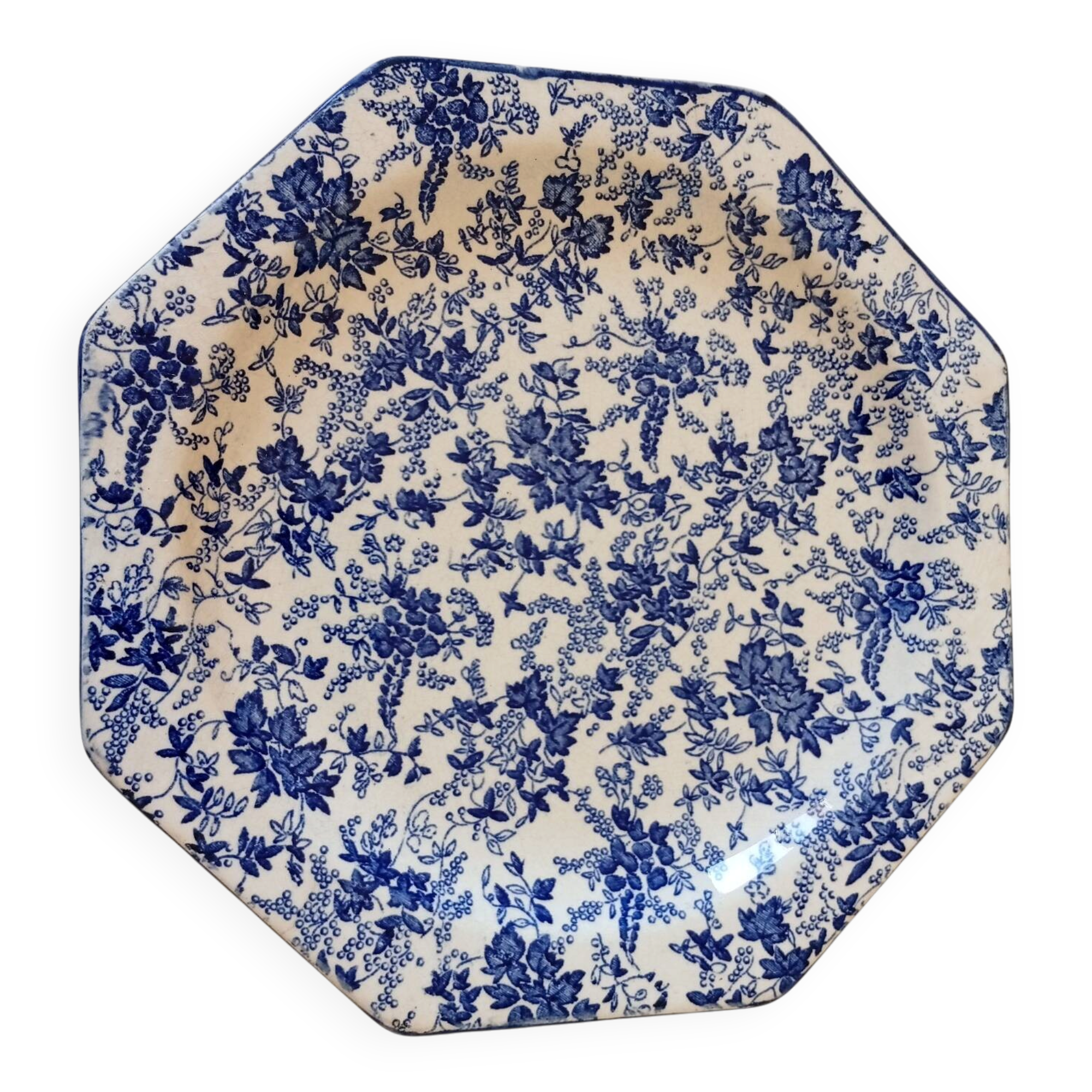 Octagonal blue dessert plate from the late 19th century in earthenware.