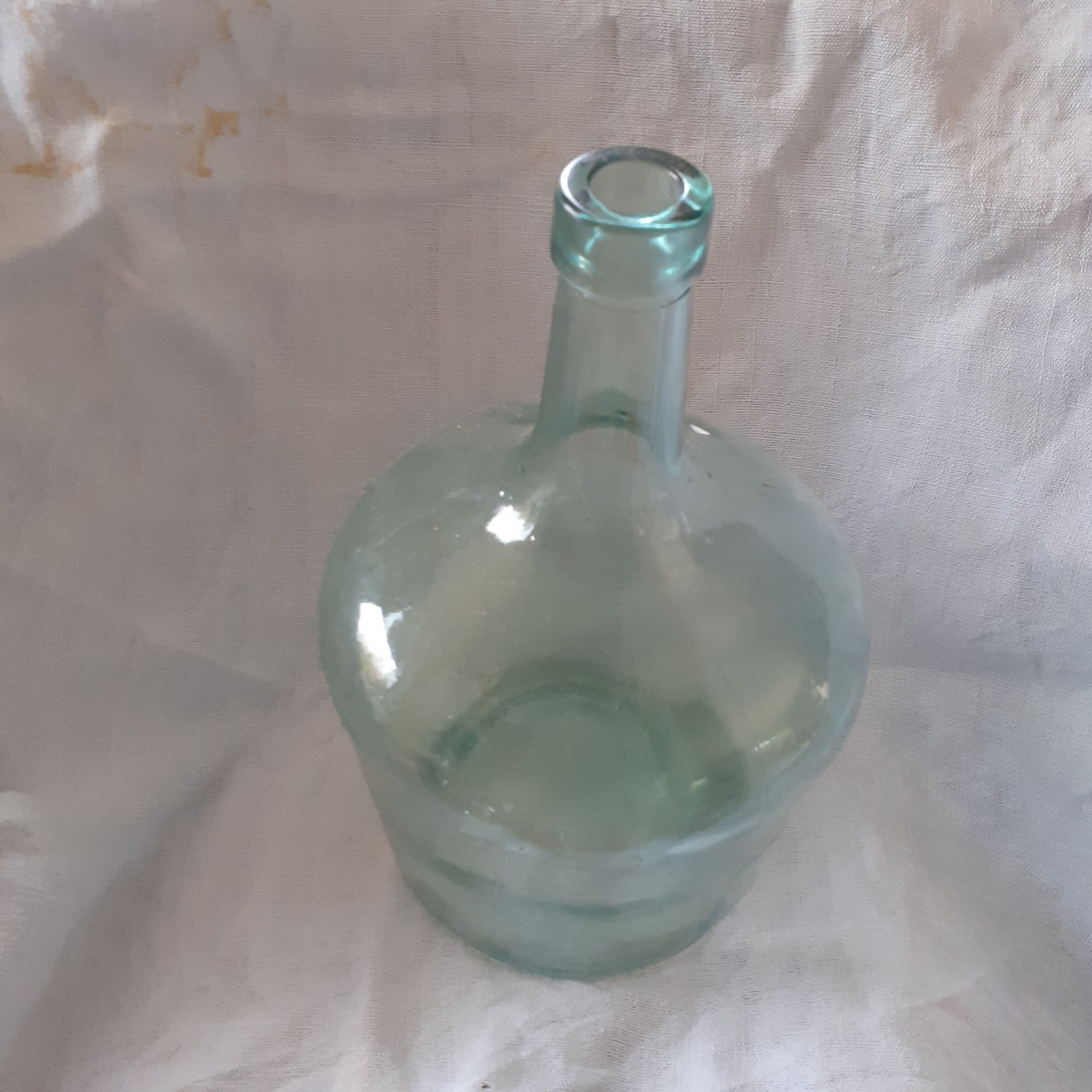 2 demijohn in light green glass.