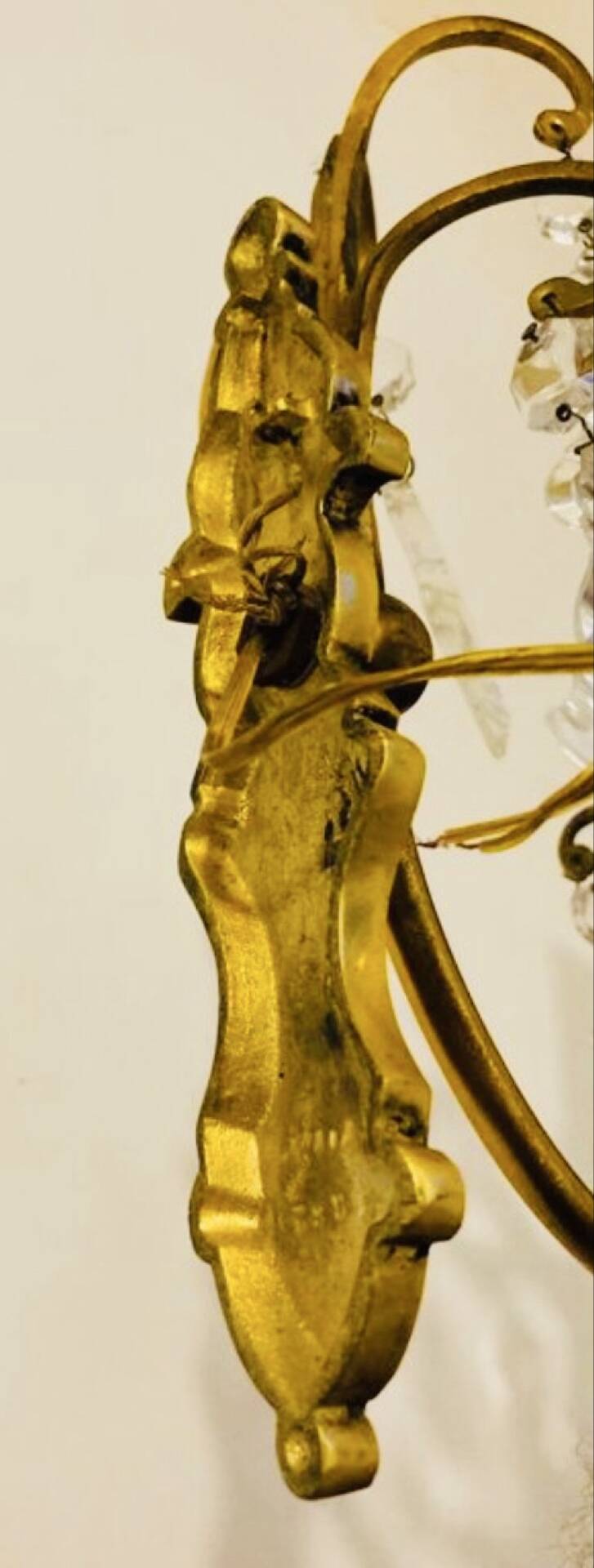 Brass wall light with glass pendants from the mid-20th century.