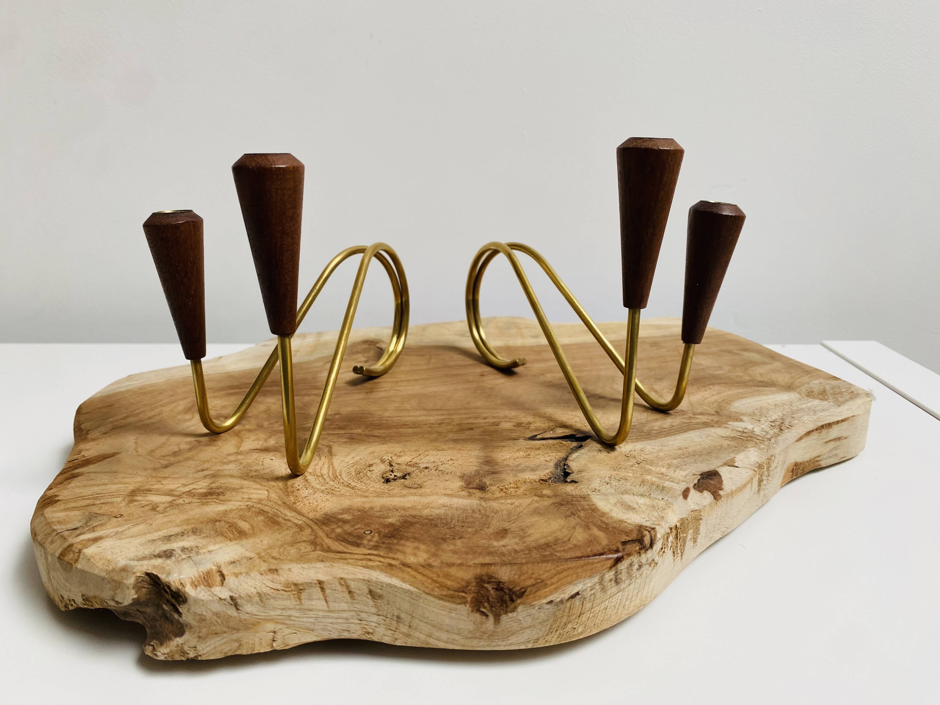 Pair of teak and brass candlesticks