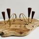 Pair of teak and brass candlesticks