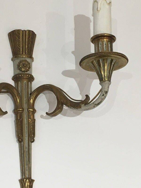 Pair of Louis XVI style wall sconces in bronze with an off-white patina