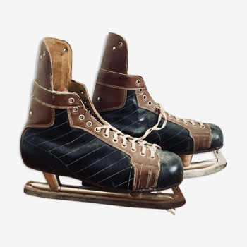 Pair of vintage lutra ice skates