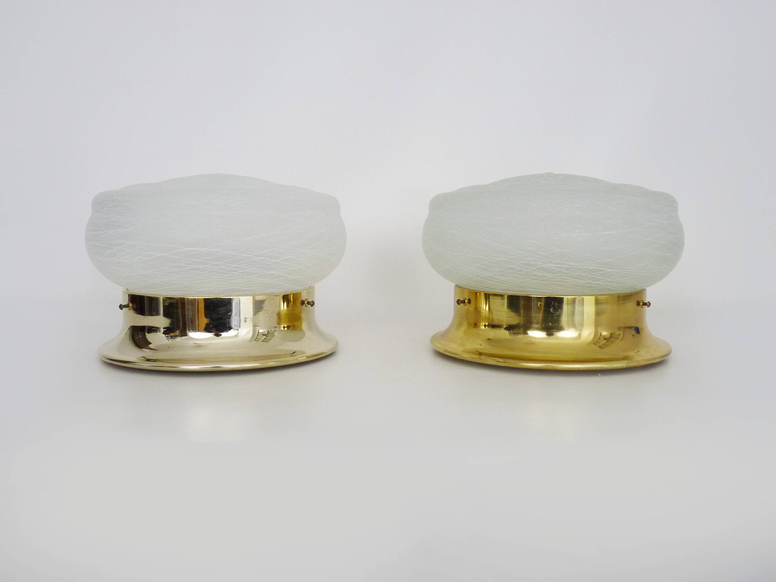 Pair of wall or ceiling lights with white-edged globe. 80 years